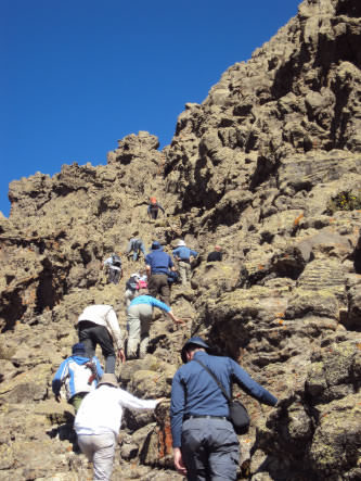 Group on a steep, single file trek to Ambiko