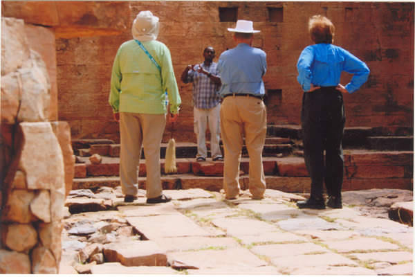 Nightjar Tour Guide talking to group of tourists in the Temple of Yeha