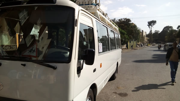 White bus waiting for tourists to arrive